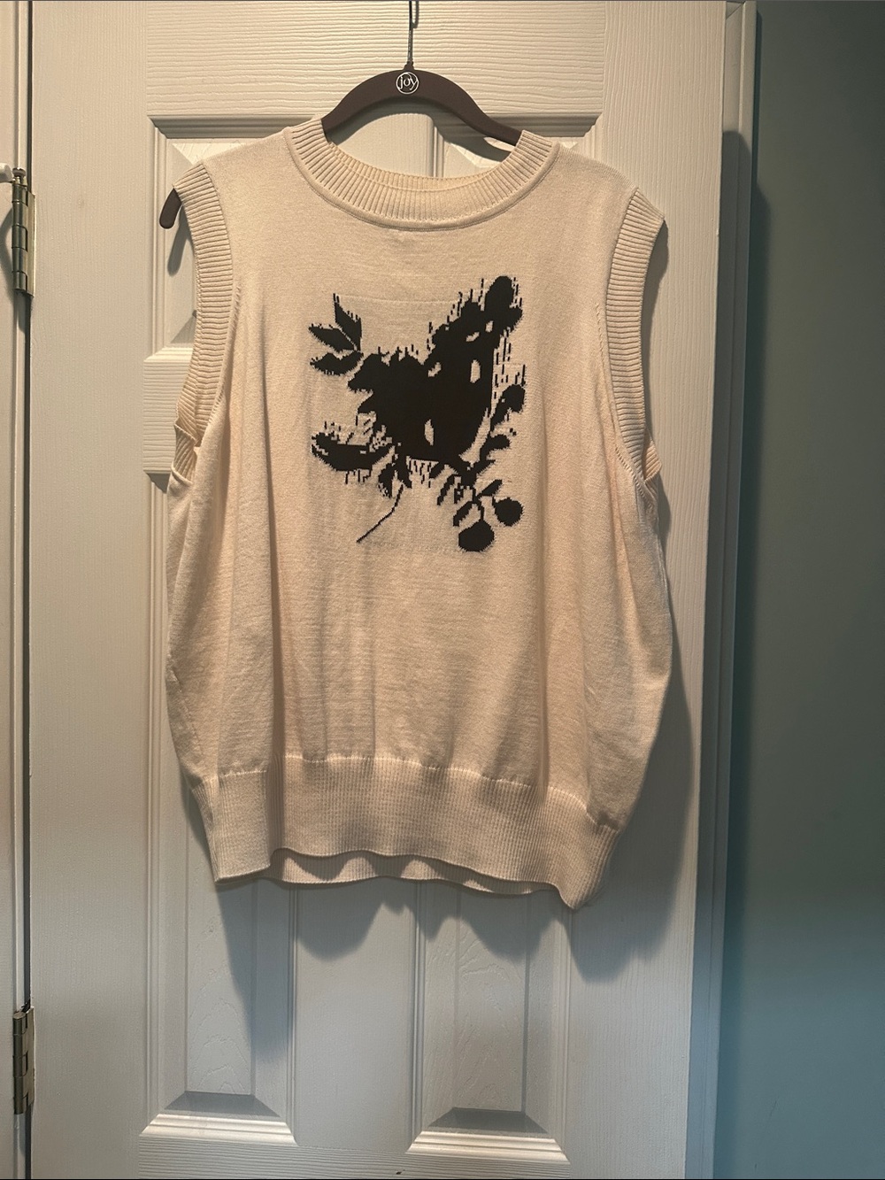 Cream Sleeveless Knit Sweater with Black Floral Motif